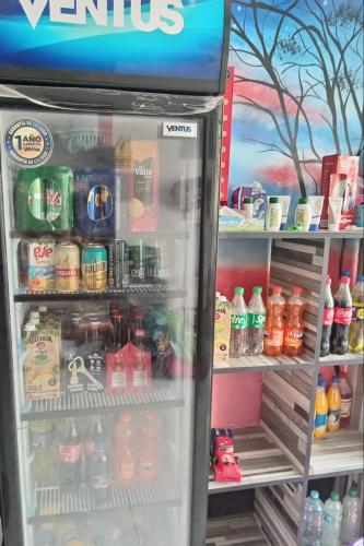 a refrigerator filled with lots of food and drinks at HOSPEDAJE MARISCAL CASTILLA in Tumbes
