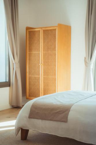 Ένα ή περισσότερα κρεβάτια σε δωμάτιο στο Maison Balas