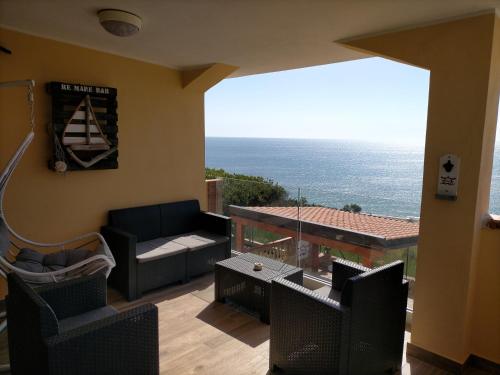 a living room with a view of the ocean at Re Mare B&B in Crotone