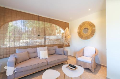 a living room with a couch and a chair at CostaBlancaDreams Casa Narciso in Calpe in Empedrola