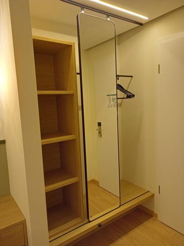 a walk in closet with a glass shower at Altes Bräuhaus in Gaildorf
