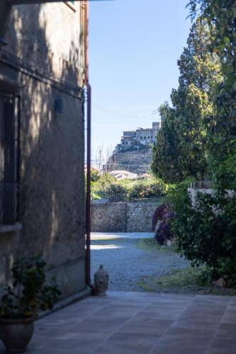 an open door to a courtyard with a bridge at DIMORA LE PIETRE DEL MARE in Pizzo