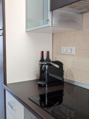 a kitchen with a coffee maker on a counter at Gemma del mare in Crotone