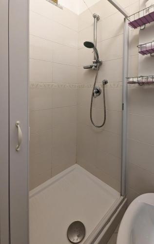 a bathroom with a shower with a sink and a toilet at Gemma del mare in Crotone