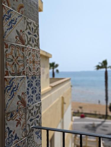 a tile wall with a view of the ocean at Gemma del mare in Crotone