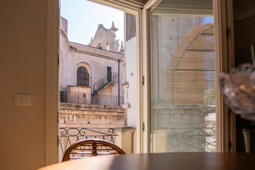a view of a building from a window at San Giuseppe apartment con Terrazza in Siracusa