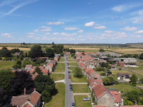 an aerial view of a small town with houses at The Horseshoe Country Inn in Pickering