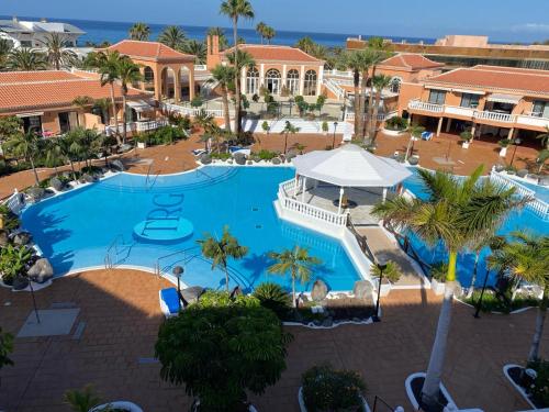 an overhead view of a swimming pool at a resort at Wonderful stay in Tenerife Royal Gardens Resort! in Playa de las Americas