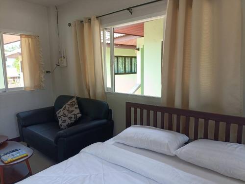 Giường trong phòng chung tại Wasin House One Bedrooms