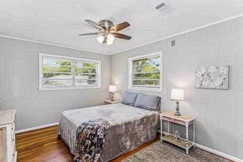 a bedroom with a bed and a ceiling fan at 2967 Swan Lane in Pensacola