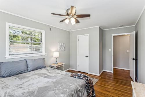 a bedroom with a bed and a ceiling fan at 2967 Swan Lane in Pensacola