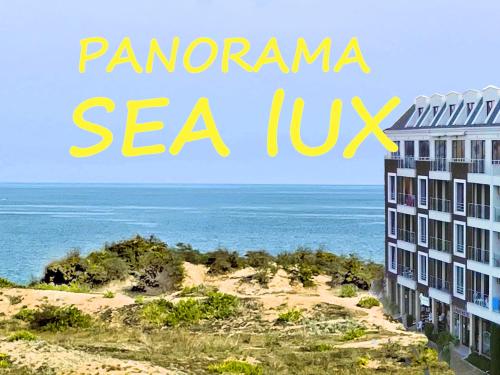 a view of the ocean and a building with the words panoramic sea at Apart-Hotel Panorama Sea LUX in Primorsko