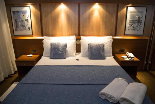 Postel nebo postele na pokoji v ubytování Hotel Motel Ovest