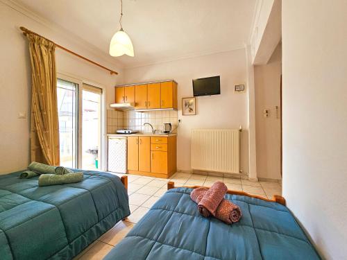 Ένα ή περισσότερα κρεβάτια σε δωμάτιο στο Hotel Exarhos