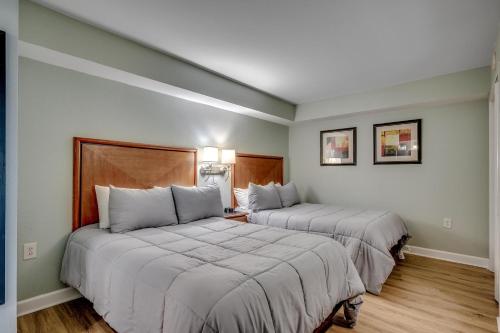 En eller flere senge i et værelse på Bay View Resort 1707A