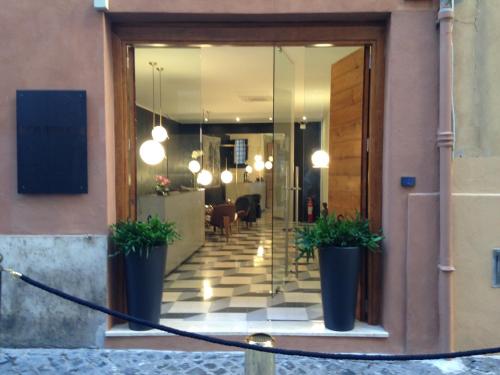 a large room with a large door and a large window at Navona Theatre Hotel in Rome