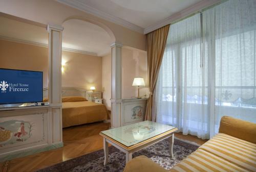 Postel nebo postele na pokoji v ubytování Hotel Firenze