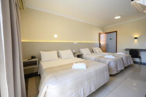 Postel nebo postele na pokoji v ubytování Colonial Flat Hotel
