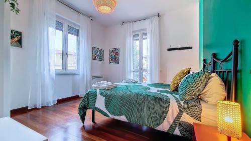 a bedroom with a bed and a chair in it at Il Passatore in Forlì