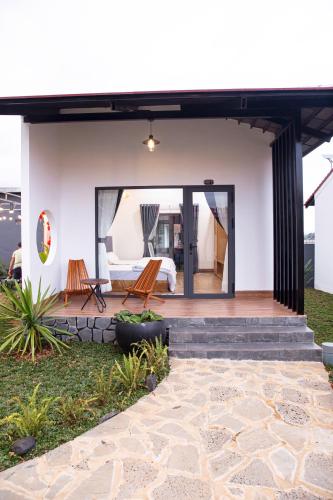 a house with a view of the patio at Bảo Lộc Home in Bao Loc