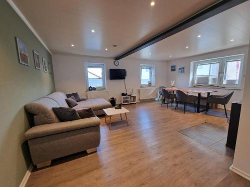 a living room with a couch and a table at Ferienhaus Quell in Sankt Martin