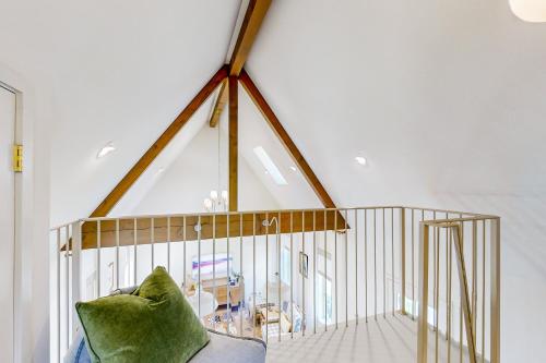 a living room with a large skylight in a house at Eco-Chic Lake Somerville Area Farmhouse w/ Porch in Brenham