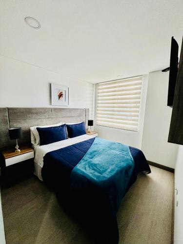 Ένα ή περισσότερα κρεβάτια σε δωμάτιο στο Magnifico y Confortable Apartamento Amoblado