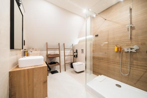 a bathroom with a shower and a sink and a toilet at Termy Szaflary in Szaflary