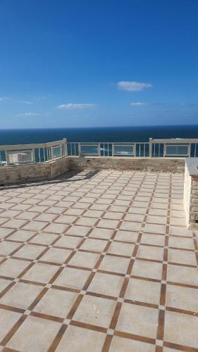a view of the ocean from the roof of a building at برج الصفوه القبطان محمد يسرى للعائلات family only in Alexandria