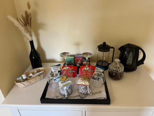 a tray of food on a counter with a coffee maker at Oronsay Guest House in Alnwick