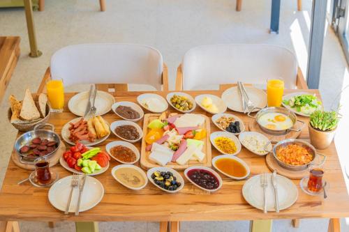 a table with many plates of food on it at Jasmine Marmaris in Marmaris