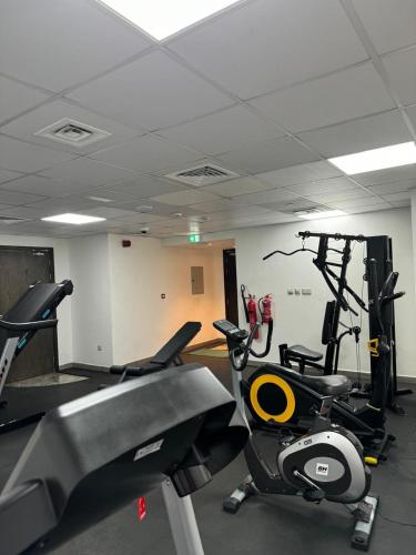 a gym with cardio equipment in a room at Garden City Hotel Dubai in Dubai