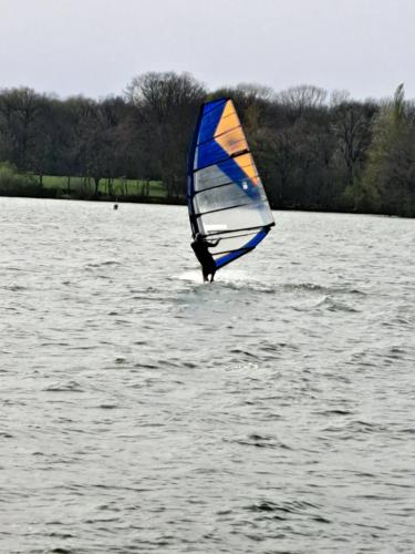 a person is windsurfing on a body of water at BATEAU - CANAL DU NIVERNAIS NIEVRE in Bazolles