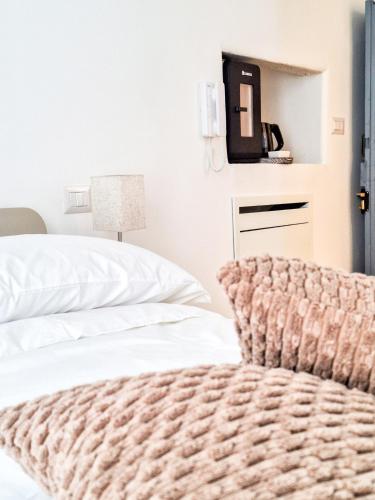 Postel nebo postele na pokoji v ubytování Intrecci B&B