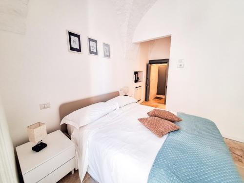 Postel nebo postele na pokoji v ubytování Intrecci B&B