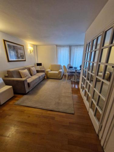 a living room with a couch and a table at Apartment luxury Archimede 80 in Rome