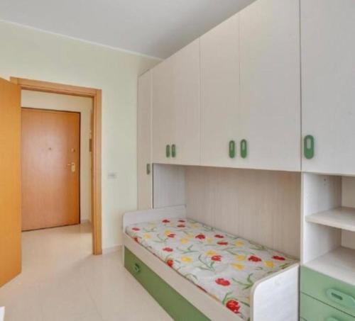 Postel nebo postele na pokoji v ubytování L’orchidea rooms, cucina e bagno in comune