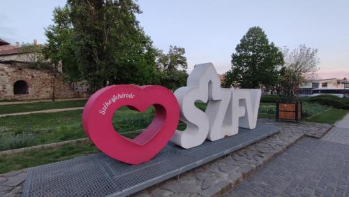 a large sign with a heart and the word spa at Fehérvár Cappuccino apartman City center, AC, Easy Parking in Székesfehérvár