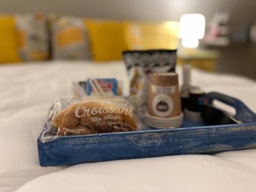 a box of products sitting on a bed at Sabbia & mare in Porto Torres