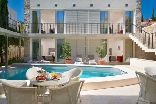 Luxury Beachfront Villa Castello Bol with private pool at the promenade Zlatni Rat at the beach in Bol - Brac