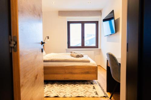 Postel nebo postele na pokoji v ubytování Magical Design Home in Tarvisio