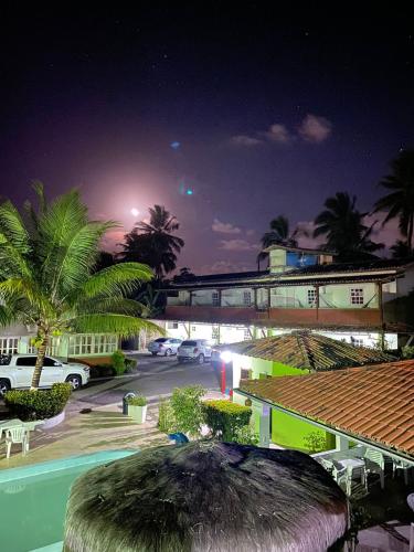a view of a parking lot at night at Pousada Arco Iris Ilhéus in Ilhéus