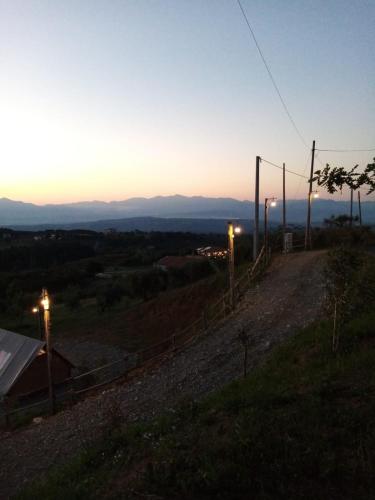a dirt road with street lights on a hill at Glamping - La Giara in San Demetrio Corone