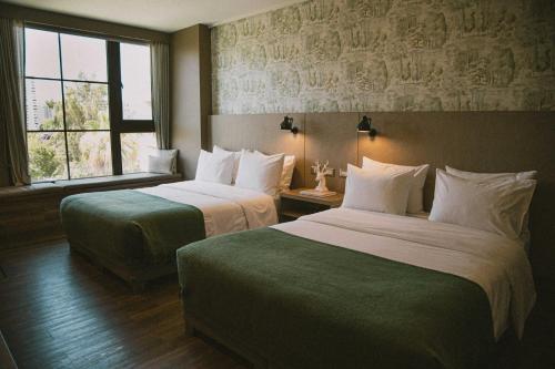 Postel nebo postele na pokoji v ubytování Hotel Eco Boutique Bidasoa