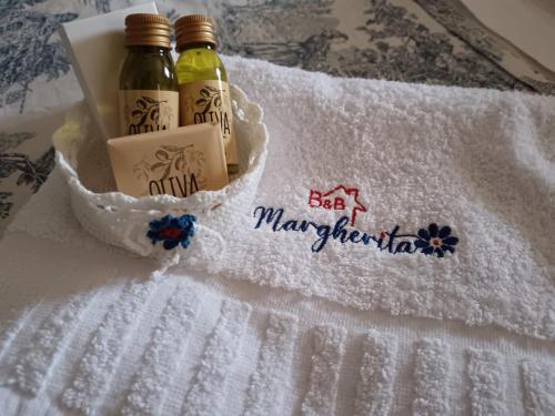 two bottles of beer sitting on a towel at Bed And Breakfast Margherita in Gerano