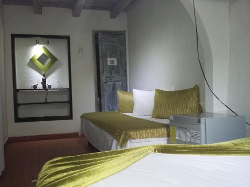 Кровать или кровати в номере Hotel San Roque Cartagena