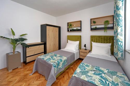 Posteľ alebo postele v izbe v ubytovaní Aqua Cabana