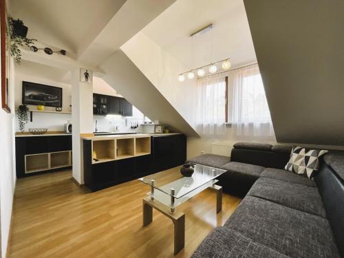 a living room with a couch and a table at Residence Hattrick in Prague