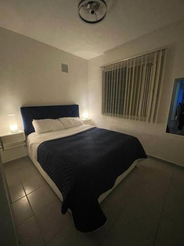 Ένα ή περισσότερα κρεβάτια σε δωμάτιο στο ACAPULCO DREAMER DIAMANTE