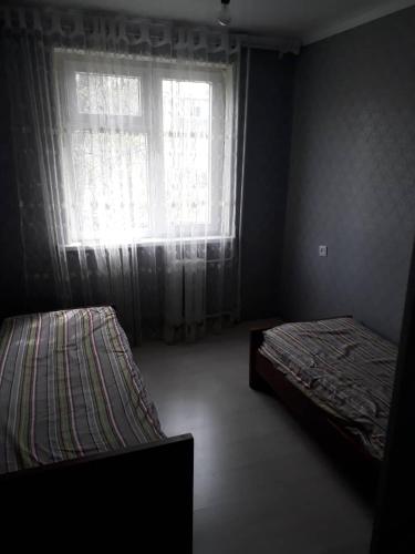 Vuode tai vuoteita majoituspaikassa Kyrgyz Wohnung